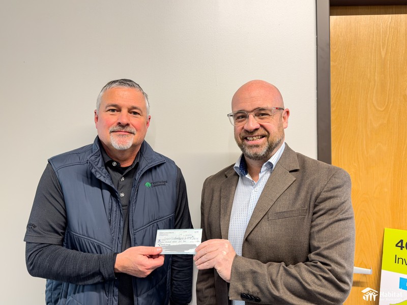Tim Philips, President/CEO of First Federal Lakewood on the left, presented the check to John Litten, President/CEO of Greater Cleveland Habitat for Humanity in February 2024.