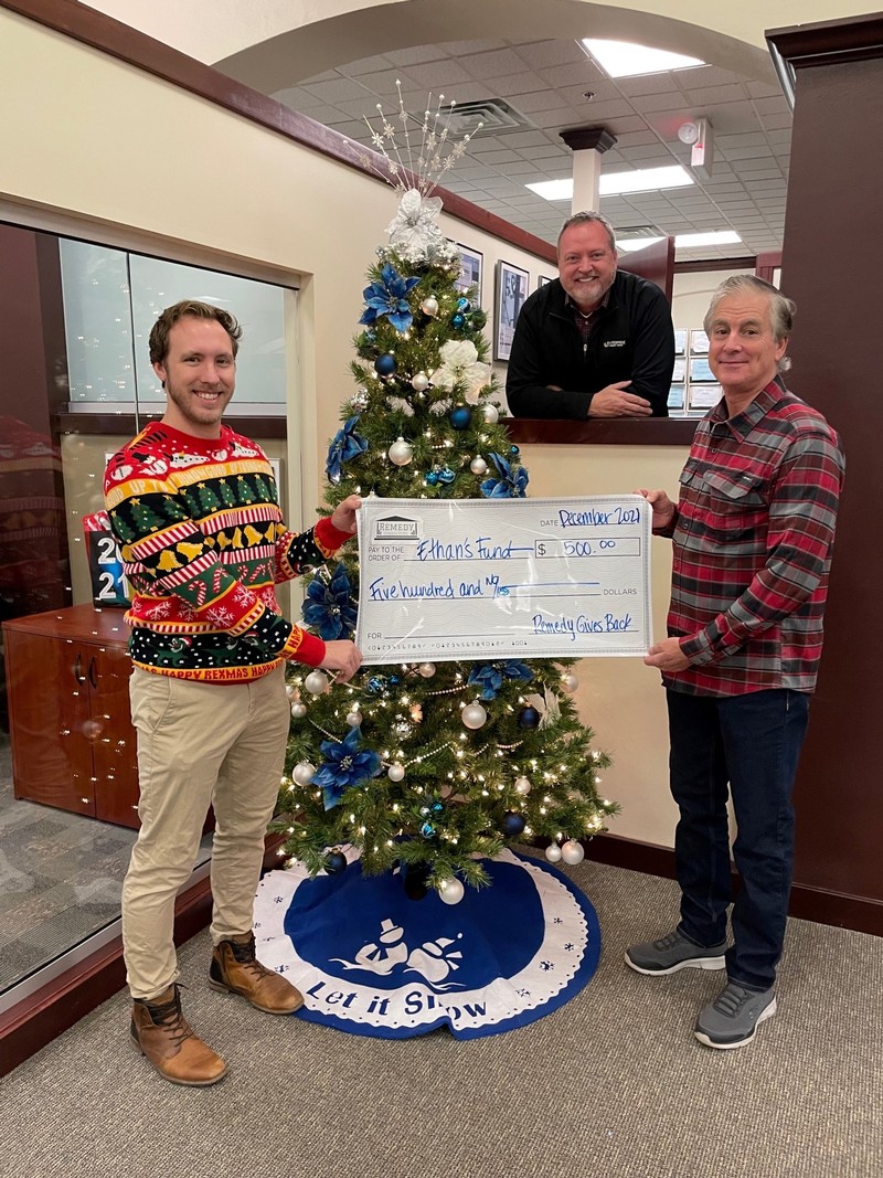Enterprise Credit Union employees presenting check to Aurora Health Care Foundation - Ethan's Fund to George Moore at the credit union in 2021 in Brookfield, WI.