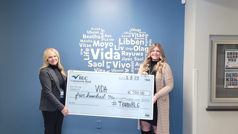 Anne Tretinyak, J.D. (left), Executive Director at Vida Medical Clinic and Support Services, received the check from Heather Calnin, Director of Marketing and Business Development, at BLC Community Bank (WI) in January 2024.