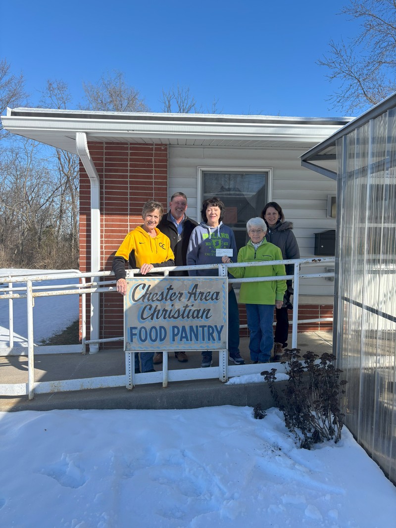 Buena Vista National Bank (IL)'s CFO, Tanya Cowan, and Senior Vice President, Charles Colvis, presenting the Chester Christian Food Pantry with the donation in January 2025.